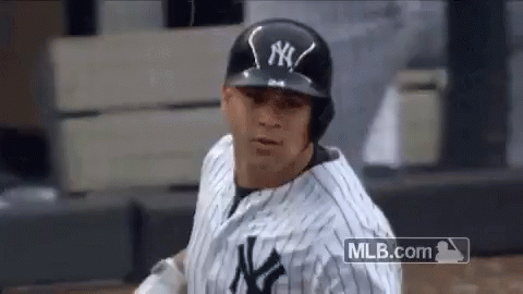 A New York Yankees Baseball Player Is Wearing A Black Helmet And A White And Black Uniform . GIF