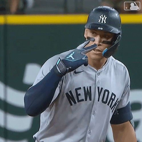A New York Yankees Baseball Player Wearing A Helmet GIF