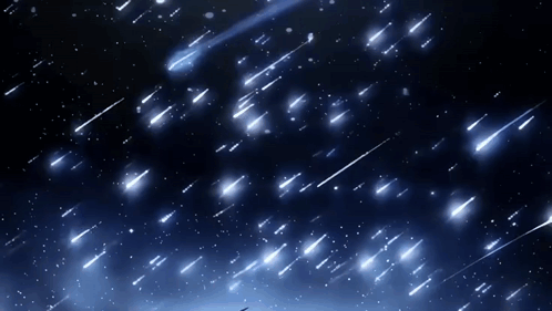 A Night Sky With A Lot Of Shooting Stars Falling GIF