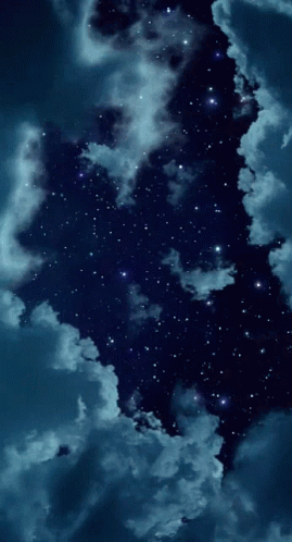 A Night Sky With Lots Of Stars And Clouds In It GIF