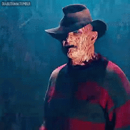 A Nightmare Before Christmas Freddy Krueger Is Wearing A Red Sweater And A Hat GIF