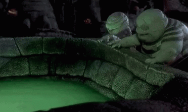 A Nightmare Before Christmas Scene With A Glowing Ball In The Middle Of A Pool Of Green Liquid . GIF