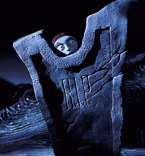A Nightmare Before Christmas Scene With Sally On A Tombstone GIF