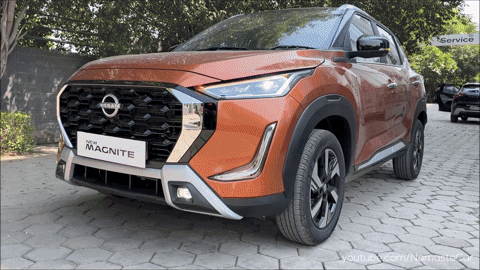 A Nissan Magnite Is Parked On A Brick Pavement GIF