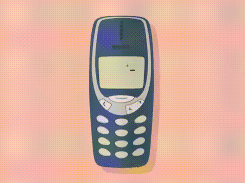 a nokia cell phone is playing a game of snake on a pink background .