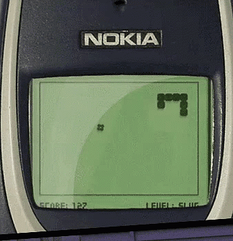 a nokia phone playing a game with a snake on the screen