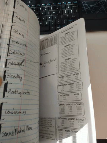 a notebook is open to a page with measurements on it