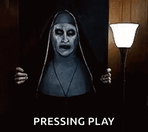 A Nun From The Movie The Conjuring Is Standing In A Dark Room Holding A Lamp And Screaming . GIF