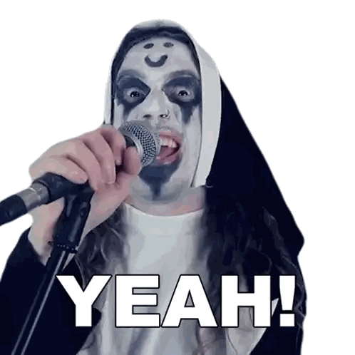 a nun is singing into a microphone with the words yeah written below her