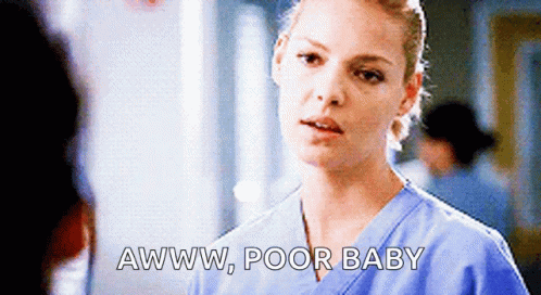 A Nurse Is Talking To A Man In A Hospital And Says Awww Poor Baby GIF