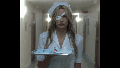 A Nurse With A Bandage On Her Eye Holds A Tray Of Supplies GIF