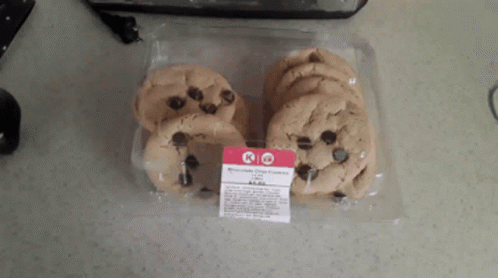 A Package Of Chocolate Chip Cookies Sitting On A Countertop GIF