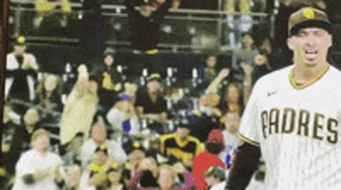 A Padres Baseball Player Stands In Front Of A Crowd Of People GIF