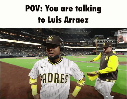 A Padres Baseball Player Talking To Luis Arraez On The Field GIF