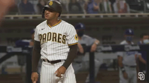 A Padres Baseball Player Wearing A Helmet Stands On The Field GIF
