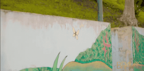 A Painting Of A Butterfly On A Wall With The Word Bragas On The Bottom GIF