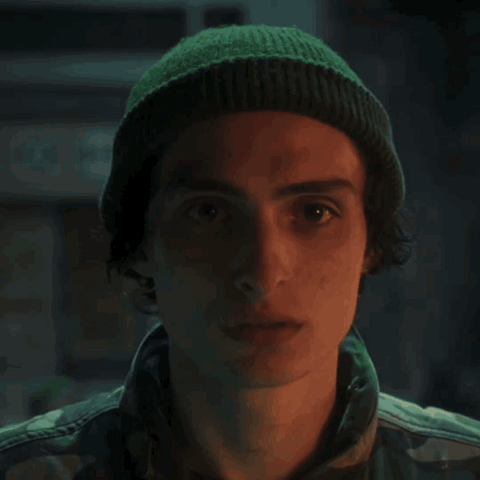 A Painting Of A Man Wearing A Helmet With The Letter M On The Front GIF