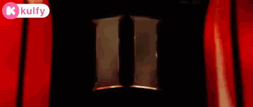 A Painting Of A Person Standing In A Dark Room Surrounded By Red And White Lights . GIF