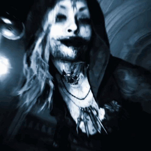 A Painting Of A Woman With A Necklace Around Her Neck And A Hood GIF