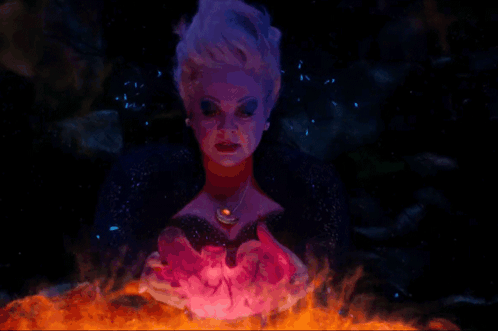 A Painting Of A Woman With A Necklace Holding A Glowing Object GIF