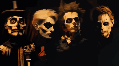 A Painting Of Four Skeletons With Skulls On Their Faces GIF