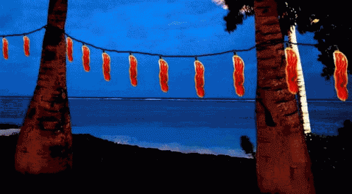 a painting of palm trees with a string of red lights hanging from them