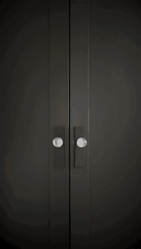 A Pair Of Black Doors With Clear Knobs And A Circle In The Middle GIF