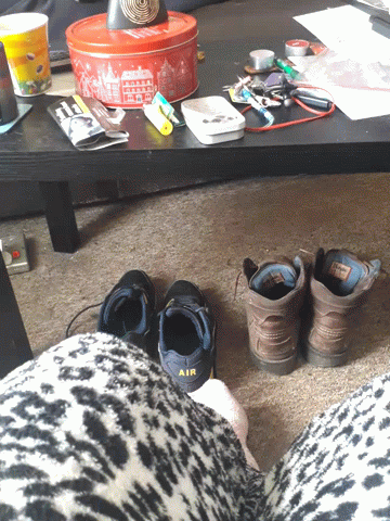 A Pair Of Black Shoes With The Word Air On Them GIF