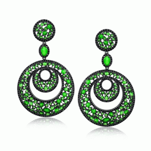 A Pair Of Earrings With Green And Black Stones On A White Background GIF