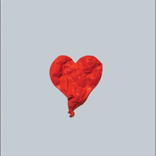 A Pair Of Hands Holding A Red Heart Shaped Object GIF