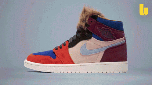 A Pair Of Nike Air Jordans With A Furry Collar GIF