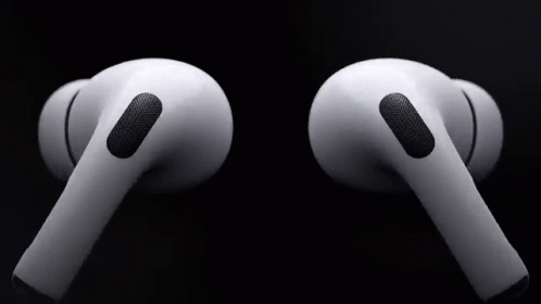 A Pair Of White Apple Airpods Pro Earbuds On A Black Background . GIF