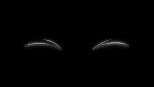 A Pair Of White Balls With Red Eyes And A Black Background GIF