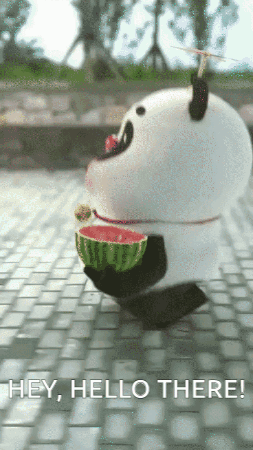 A Panda Bear Is Holding A Slice Of Watermelon In Its Mouth GIF