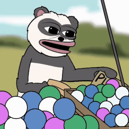 a panda bear is sitting in a box of balls with a sign that says pi