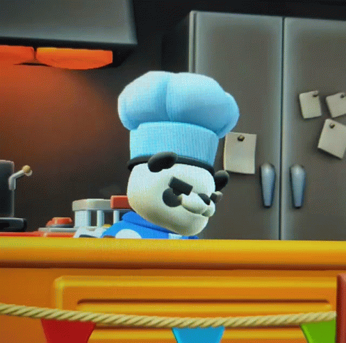 A Panda Bear Wearing A Chef 'S Hat And Sunglasses Is Standing On A Counter GIF