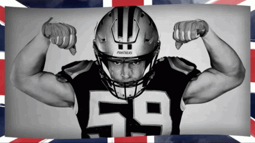 A Panthers Football Player Flexes His Muscles GIF