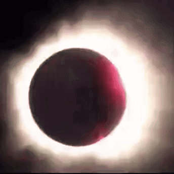 A Partial Eclipse Of The Sun With A Red Ring Around The Moon GIF