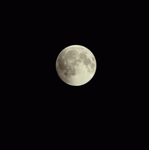 A Partial Lunar Eclipse With A Red Moon In The Dark GIF