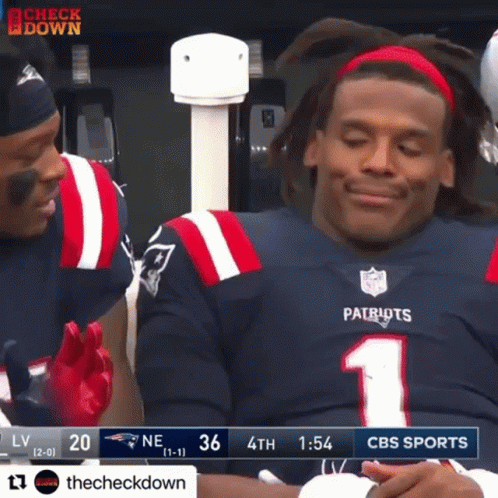 A Patriots Football Player Is Sitting In The Stands During A Game GIF