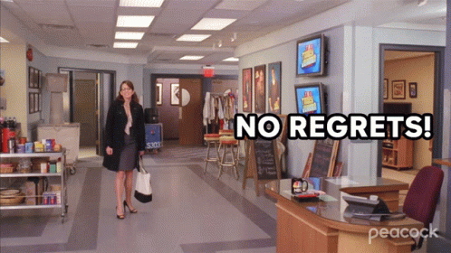A Peacock Ad Shows A Woman Walking Through An Office GIF
