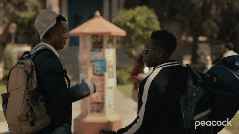 A Peacock Ad Shows Two Young Men Talking GIF