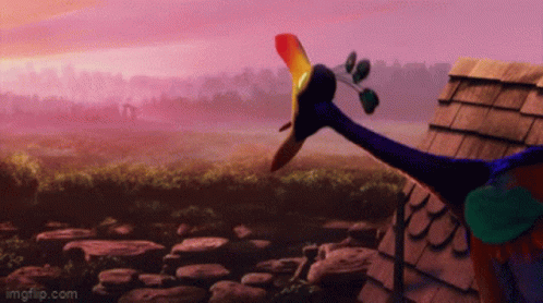 A Peacock With A Long Neck Is Standing In Front Of A Roof GIF