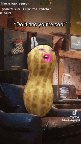 A Peanut With A Stitcher 'S Hat On Is Sitting In A Chair GIF
