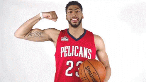 A Pelican 'S Basketball Player Flexes His Muscles While Holding A Spalding Basketball GIF