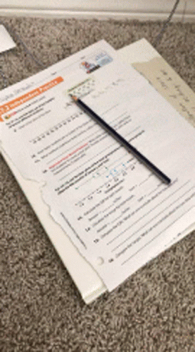 A Pencil Is Sitting On Top Of A Piece Of Paper That Says ' A ' On It GIF