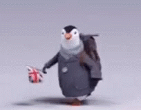 A Penguin Carrying A Backpack And Holding A British Flag GIF