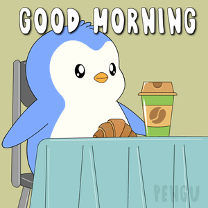 A Penguin Is Sitting At A Table With A Cup Of Coffee And A Croissant GIF