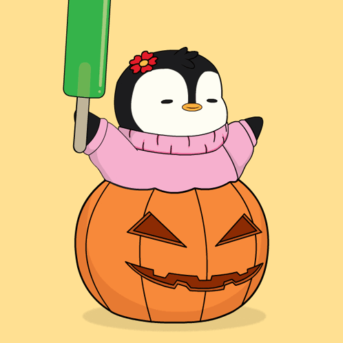 A Penguin Is Sitting On Top Of A Pumpkin And Holding A Green Popsicle GIF