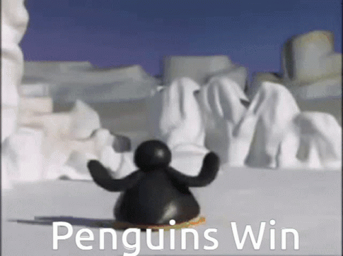 A Penguin Is Standing In The Snow With The Words Penguins Win Behind Him GIF